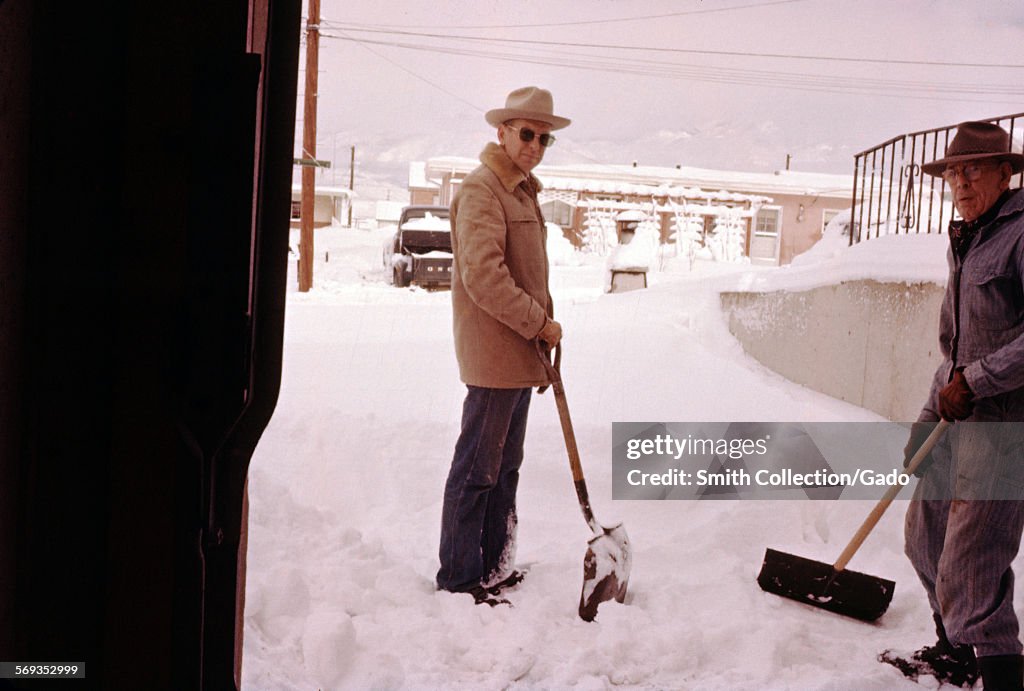 Two Men Shoveling Snow, Wearing