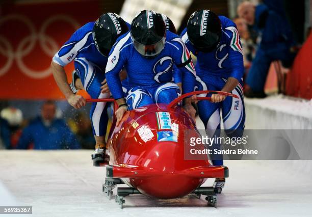 Pilot Simone Bertazzo and teammates Samuele Romanini, Matteo Torchio and Omar Sacco of Italy 1 compete in the Four Man Bobsleigh Final on Day 15 of...