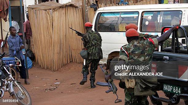 Ugandan police arrive 25 February 2006 near the opposition Forum for Democratic Change headquarters in western Kampala. Police fired live rounds and...