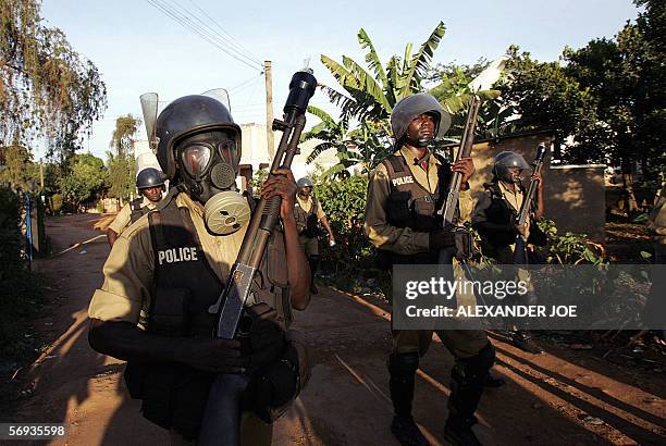 Ugandan police search for rock-throwers 25 February 2006 after dispersing with live rounds and teargas supporters of opposition leader Kizza Besigye...