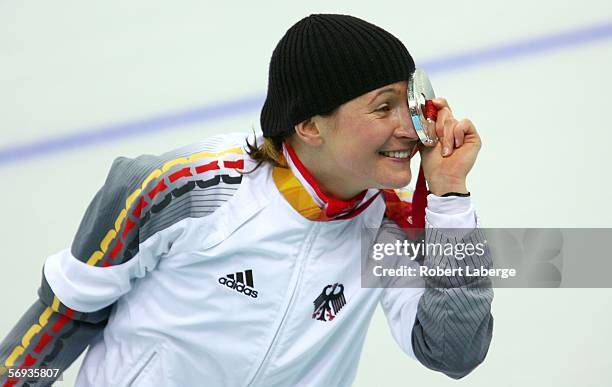 Claudia Pechstein of Germany celebrates winning the Silver medal during the medal ceremony after the 5,000 meters women's Speed skating final during...