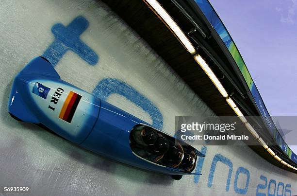 Pilot Andre Lange and teammates Rene Hoppe, Kevin Kuske and Martin Putze of Germany 1 start their run in the Four Man Bobsleigh Final on Day 15 of...