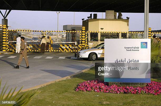 Saudi security guard the entrance of the oil processing plant of the Saudi state oil giant Aramco in Abqaiq in the oil-rich Eastern Province, 25...