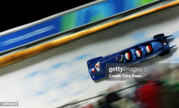 Pilot Bruno Mingeon and teammates Christophe Fouquet, Pierre-Alain Menneron and Alexandre Vanhoutte of France 1 compete in the Four Man Bobsleigh...