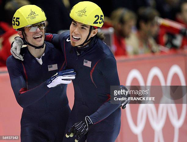 Team USA's Apollo Ohno and Rusty Smith celebrate after the mens' 5000m relay final during the short track competition at the 2006 Winter Olympics, 25...