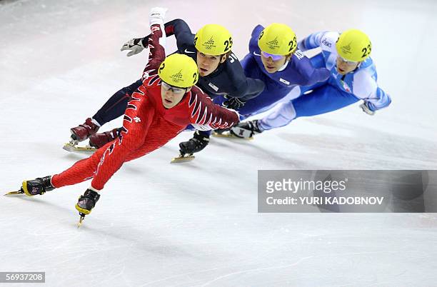 Team Canada's Mathieu Turcotte leads during the mens' 5000m relay final during the short track competition at the 2006 Winter Olympics, 25 February...