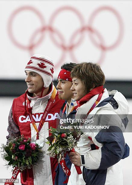 Gold medalist US Apollo Anton Ohno , Canada's Francois-Louis Tremblay and bronze medalist South Korea's Ahn Hyun-Soo pose on the podium of the men's...