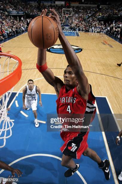 Chris Bosh of the Toronto Raptors dunks the ball against the Dallas Mavericks on February 25, 2006 at American Airlines Center in Dallas, Texas. The...