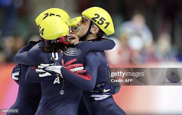 Team USA celebrate after the mens' 5000m relay final of the short track competition at the 2006 Winter Olympics, 25 February 2006 at the Palavela in...