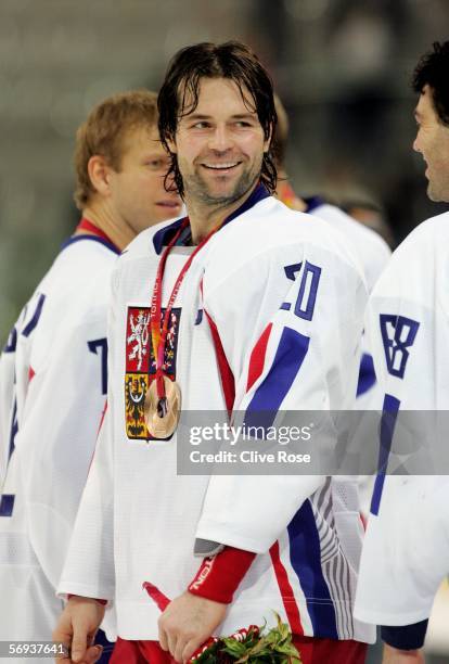 Robert Lang of Czech Republic talks to his teammate Jaromir Jagr of Czech Republic after they won the bronze medal match of the men's ice hockey...