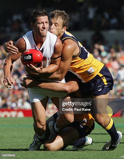 Adam Hunter of the Eagles lands a tackle on Josh Carr of the Dockers during the round one NAB Cup match between the West Coast Eagles and the...