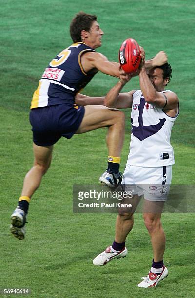 Tyson Stenglein of the Eagles collides into Peter Bell of the Dockers during the round one NAB Cup match between the West Coast Eagles and the...