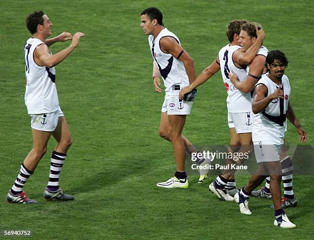 James Walker of the Dockers is congratulated by team mates after kicking a goal during the round one NAB Cup match between the West Coast Eagles and...