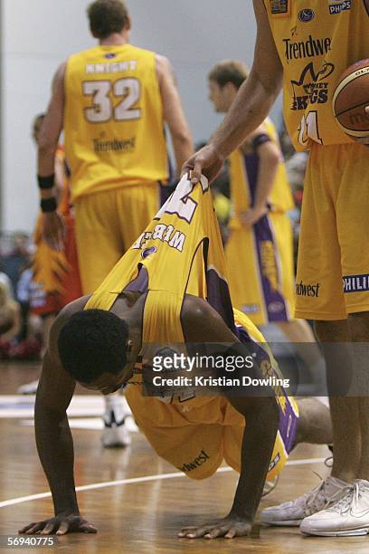 Sedric Webber for the Kings is picked up by a team-mate after falling during Game 2 of the NBL Grand Final between the Melbourne Tigers and the...