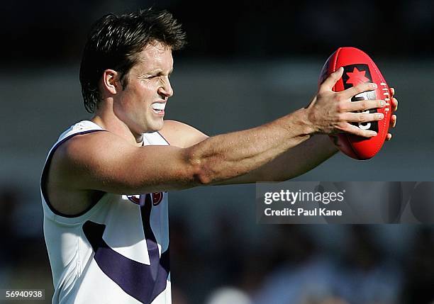 Luke McPharlin of the Dockers holds the ball out to the opposition during the round one NAB Cup match between the West Coast Eagles and the Fremantle...