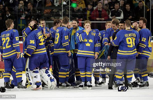 Team Sweden celebrates defeating Finland 3-2 to win the gold medal in the final of the men's ice hockey match between Finland and Sweden during Day...