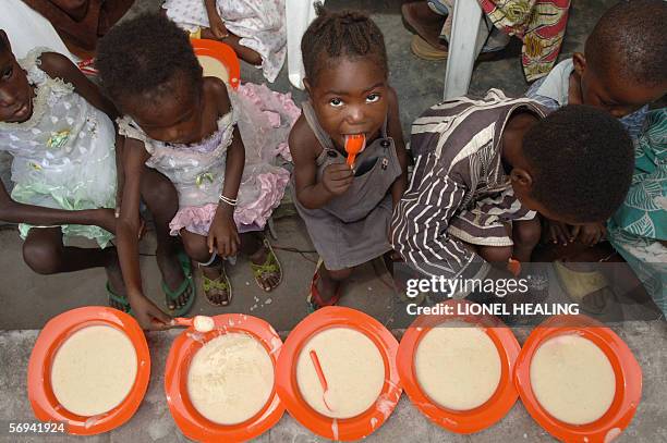 Kinshasa, Democratic Republic of the Congo: Children eat at a nutritional centre during the visit of the Executive Director of the World Food...