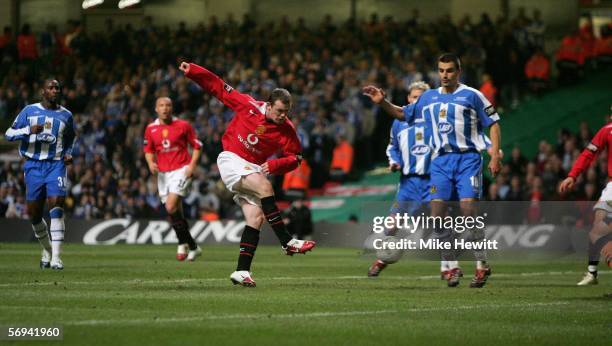 Wayne Rooney of Manchester United scores his team's fourth goal during the Carling Cup Final match between Manchester United and Wigan Athletic at...
