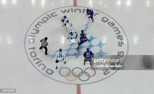 The puck drops during the final of the men's ice hockey match between Finland and Sweden during Day 16 of the Turin 2006 Winter Olympic Games on...