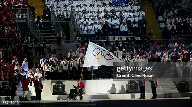The Mayor of Vancouver Sam Sullivan holds the Olympic flag after receiving from Sergio Chiamparino, the mayor of Turin during the Closing Ceremony of...