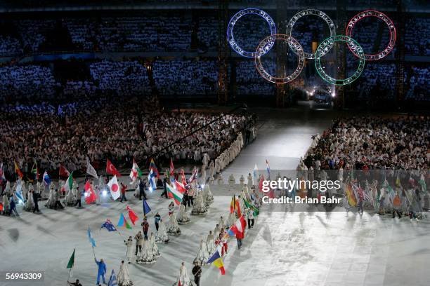 Flag bearers carrying nationa flags enter the stadium during the Closing Ceremony of the Turin 2006 Winter Olympic Games on February 26, 2006 at the...