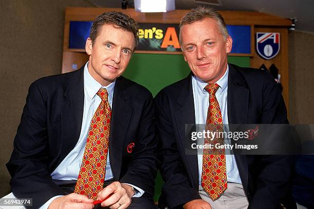 Channel 7 TV commentators Bruce McAvaney and Sandy Roberts pose for a photo during a AFL match held in Melbourne, Australia.