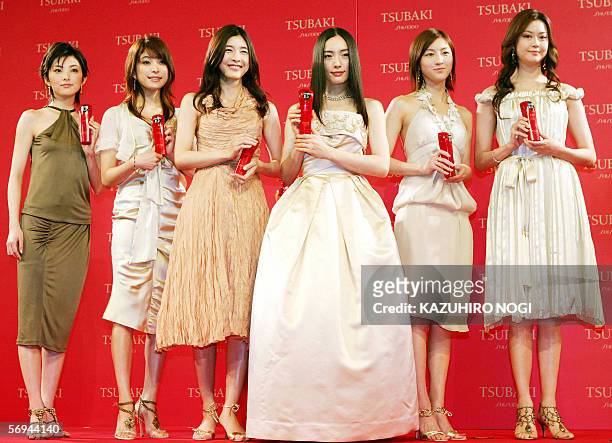 Japanese actresses Rena Tanaka, Takako Uehara, Yuko Takeuchi, Yukie Nakama, Ryoko Hirosue, and Arisa Mizuki pose at a photo session during a press...