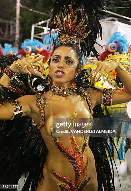 Rio de Janeiro, BRAZIL: Adriana Peritt the queen of the drums of Unidos de Vila Isabel samba school performs ahead of the musicians while their...