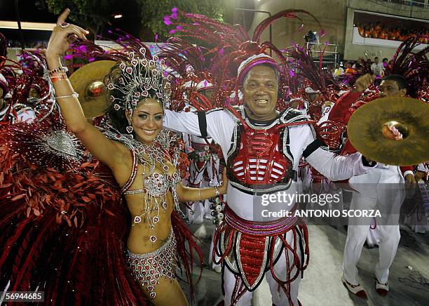 Rio de Janeiro, BRAZIL: Carol Castro, Queen of the Drums of the Academicos do Salgueiro samba school performs with the "Master of the Drums" during...
