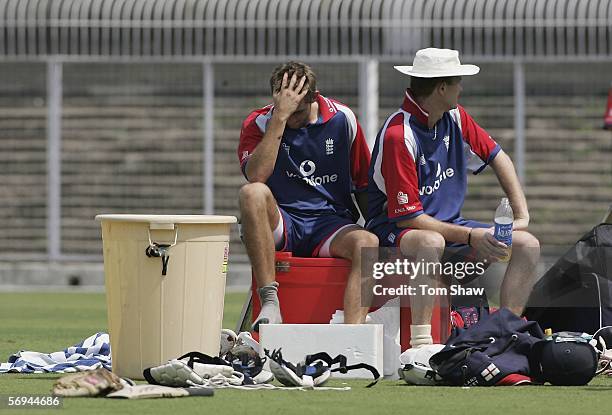 Liam Plunkett of England sits down with his foot in a bath of ice during the England nets session at the VCA Stadium on February 27 in Nagpur, India.