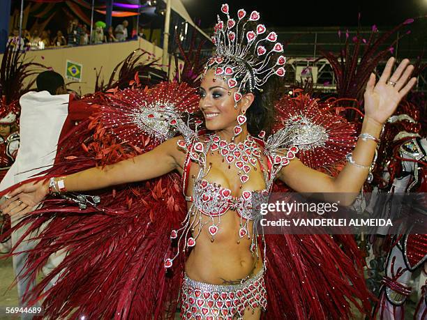 Rio de Janeiro, BRAZIL: Carol Castro, Queen of the Drums of Academicos do Salgueiro samba school, performs ahead of the musicians as their school...