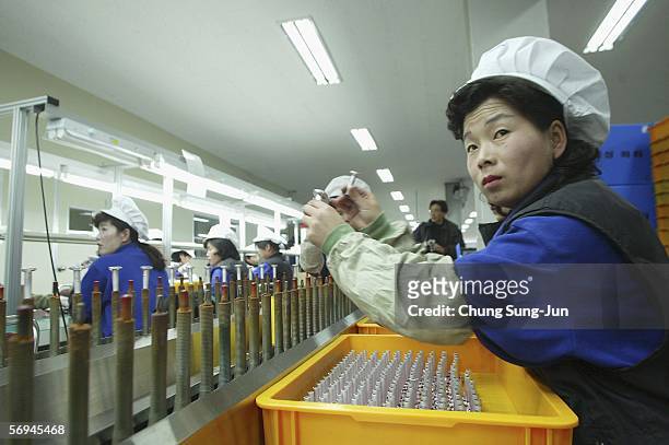 North Korean women work at the assembly line of the factory of cosmetics company Taesung Industry Inc. At the Kaesong industrial complex on February...