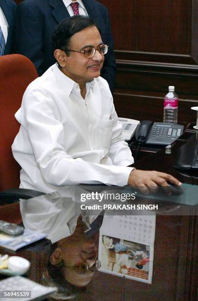 Indian Finance Minister P. Chidambaram poses for photographers at his office on the eve of the presentation of the government's federal budget for...