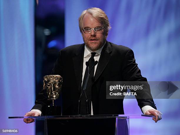 Philip Seymour Hoffman accepts the award for Best Actor In A Leading Role for Capote on stage at The Orange British Academy Film Awards at the Odeon...