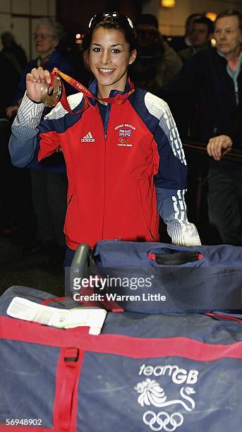 British Silver medalist, Shelley Rudman posing with her silver medal, returns from the 2006 Winter Olympics in Turin at Gatwick airport on February...