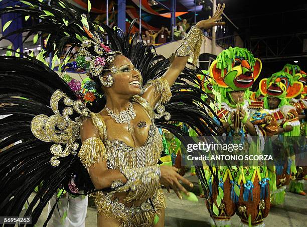 Rio de Janeiro, BRAZIL: Quiteria, Queen of the Drums of Imperio Serrano samba school performs ahead the musicians at the sambodrome avenue, 28...