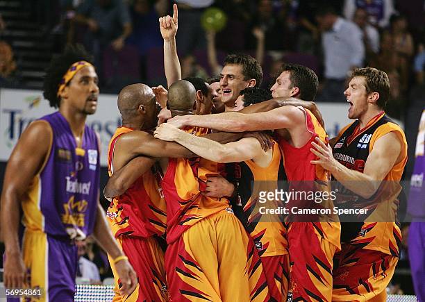 Chris Anstey of the Tigers celebrates with team mates after winning the NBL Championship after winning game three of the NBL grand final series...