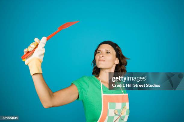 woman in apron with fly swatter - swat stock pictures, royalty-free photos & images