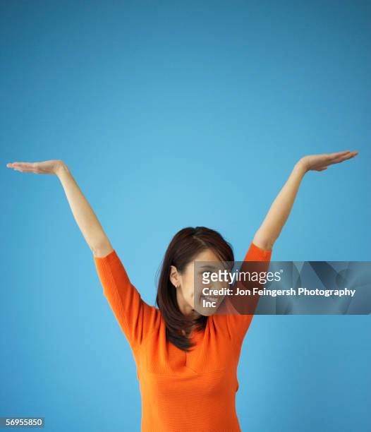 young woman with arms raised - selbstverliebt stock-fotos und bilder