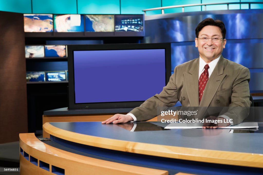 Portrait of male anchor in newsroom