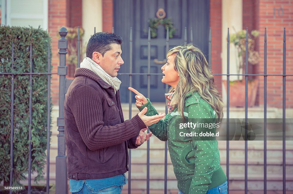 Couple having argument in a hard quarrel outdoors