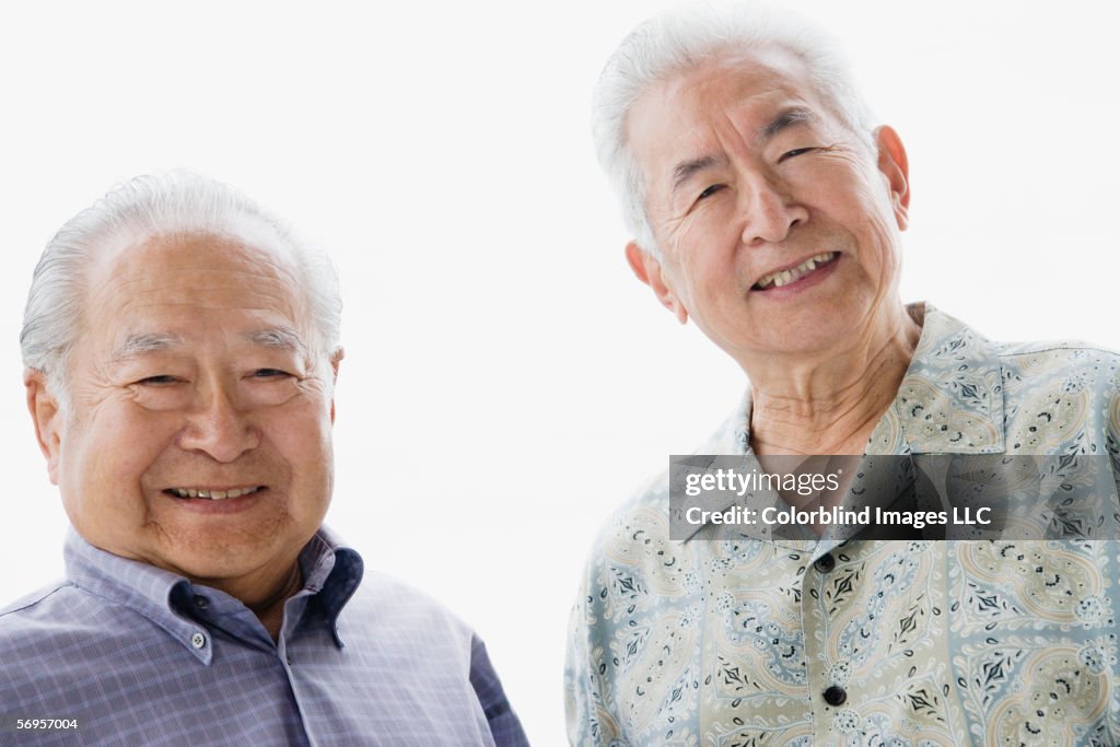 Portrait of two elderly men smiling