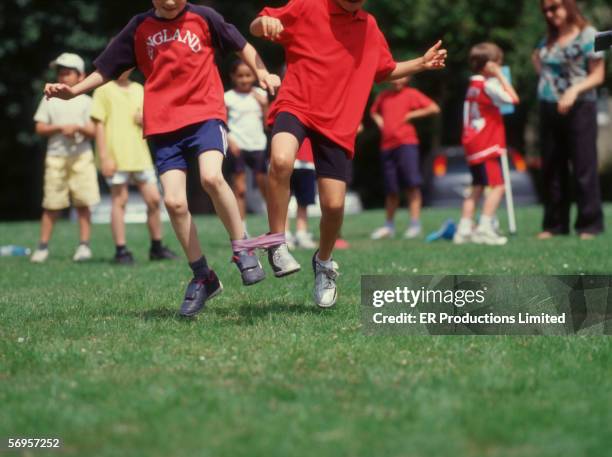Three Kids Racing 52 Three Legged Race Kids Stock Photos, High-Res Pictures, and Images ...