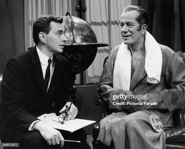 American novelist, playwright, and essayist Gore Vidal sits and talks with Australian stage actor and director Cyril Ritchard on the set of Gore's...