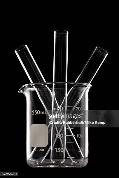 close-up of three empty test tubes in a measuring beaker - reagenzglas freisteller stock-fotos und bilder