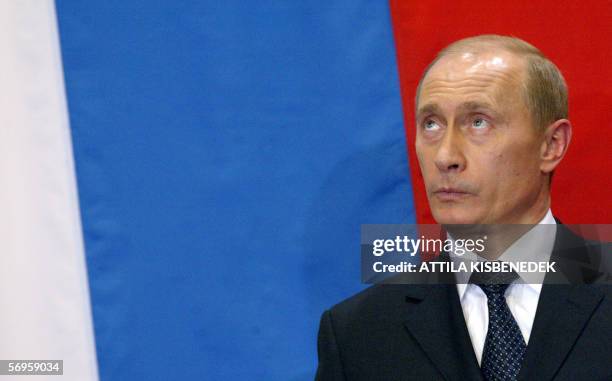 Russian President Vladimir Putin listens to a journalist' question during his press conference with Hungarian Prime Minister Ferenc Gyurcsany in...