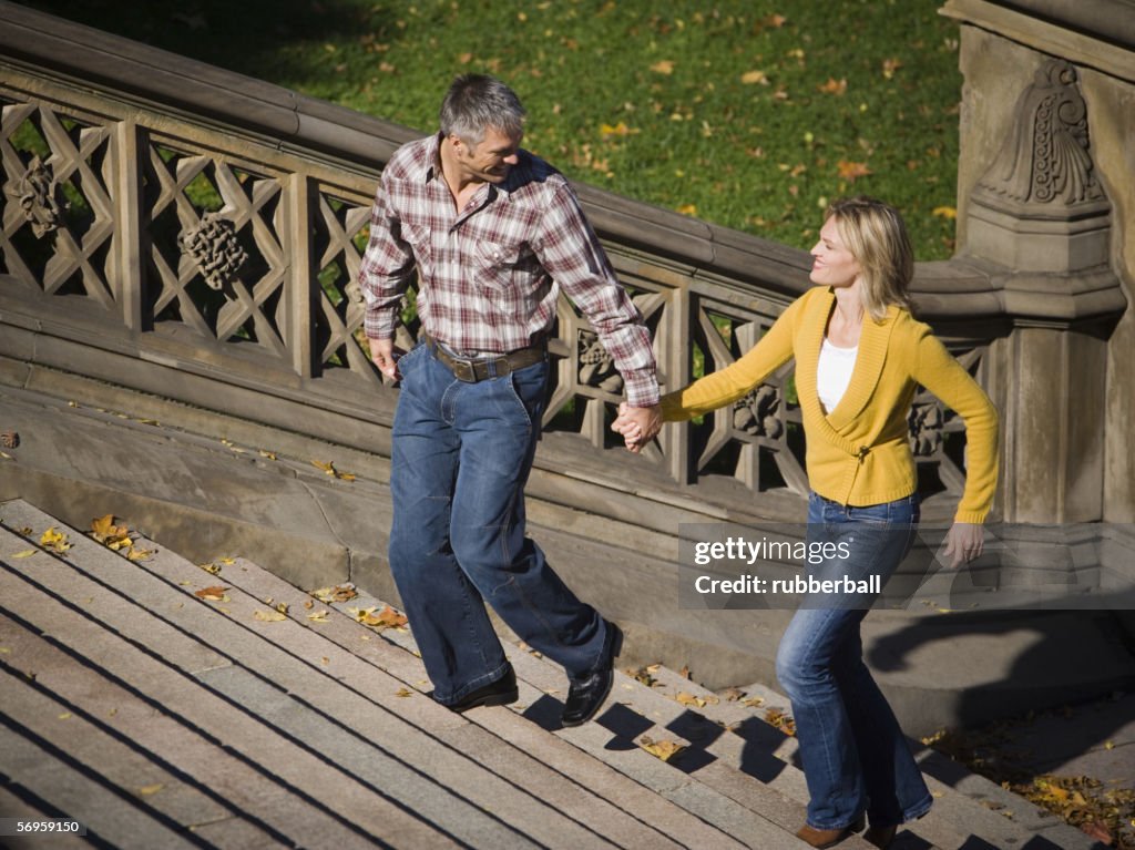 High angle view of a couple walking up stairs