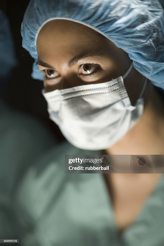 Close-up of a female surgeon in an operating room