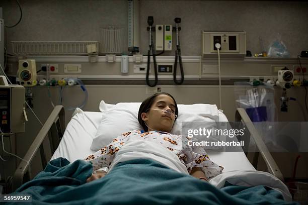high angle view of a female patient sleeping on a hospital bed - smart communicate elevation view stockfoto's en -beelden