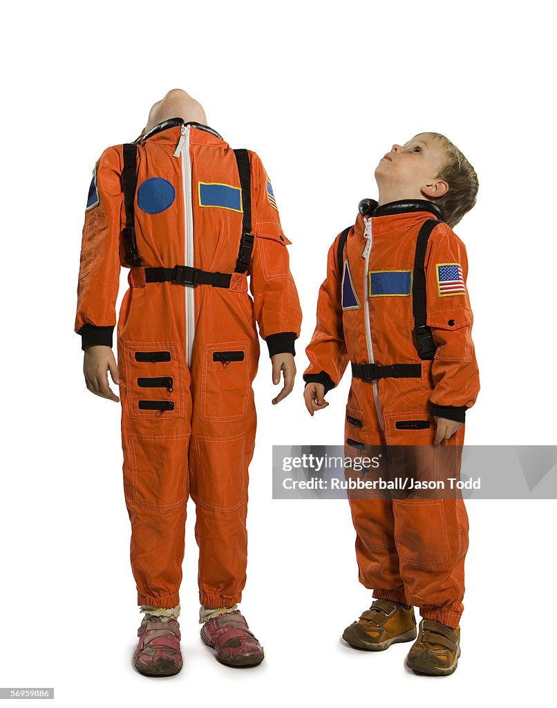 Close-up of two boys in astronaut costumes